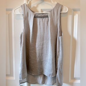 Grey classy sleeveless blouse with silver embellishment. Size Small